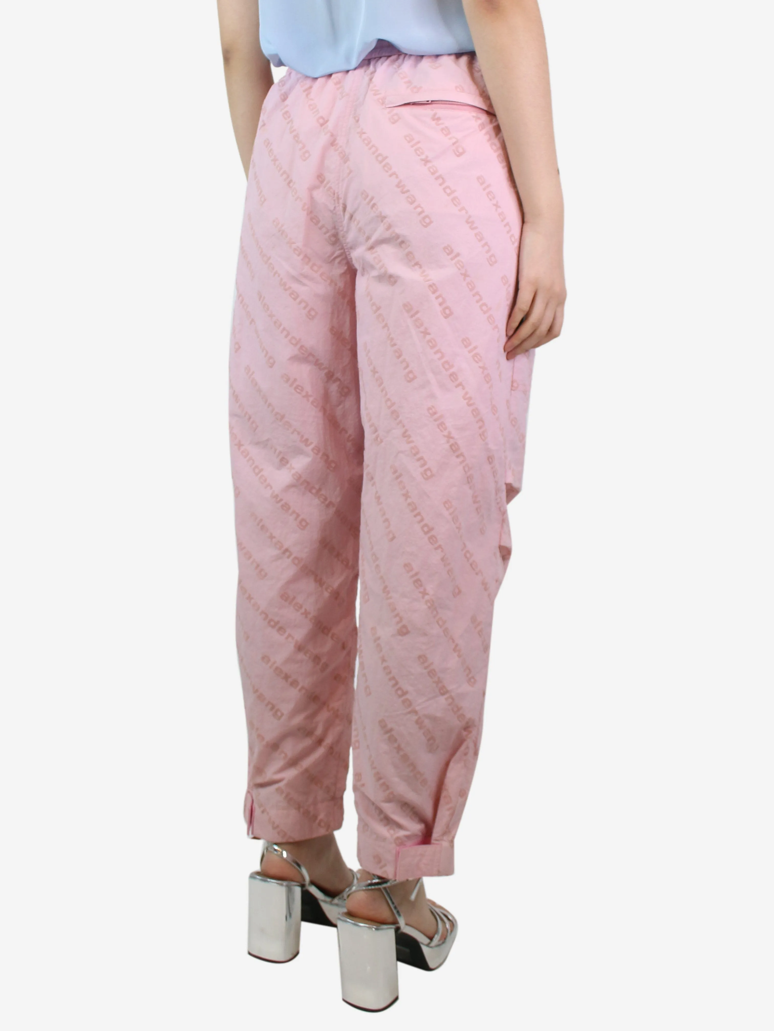 Light pink all-over flocked logo trousers - size M