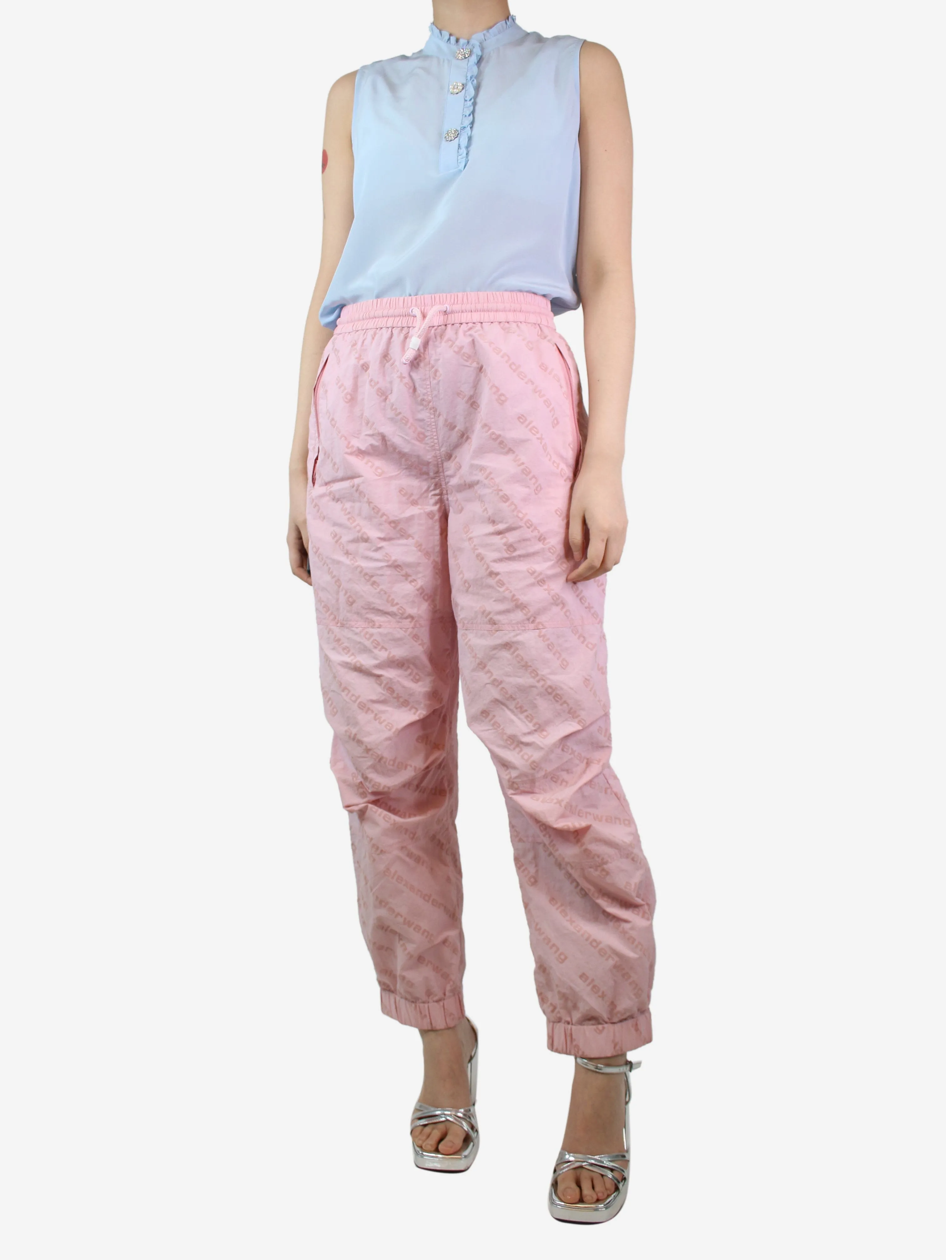 Light pink all-over flocked logo trousers - size M