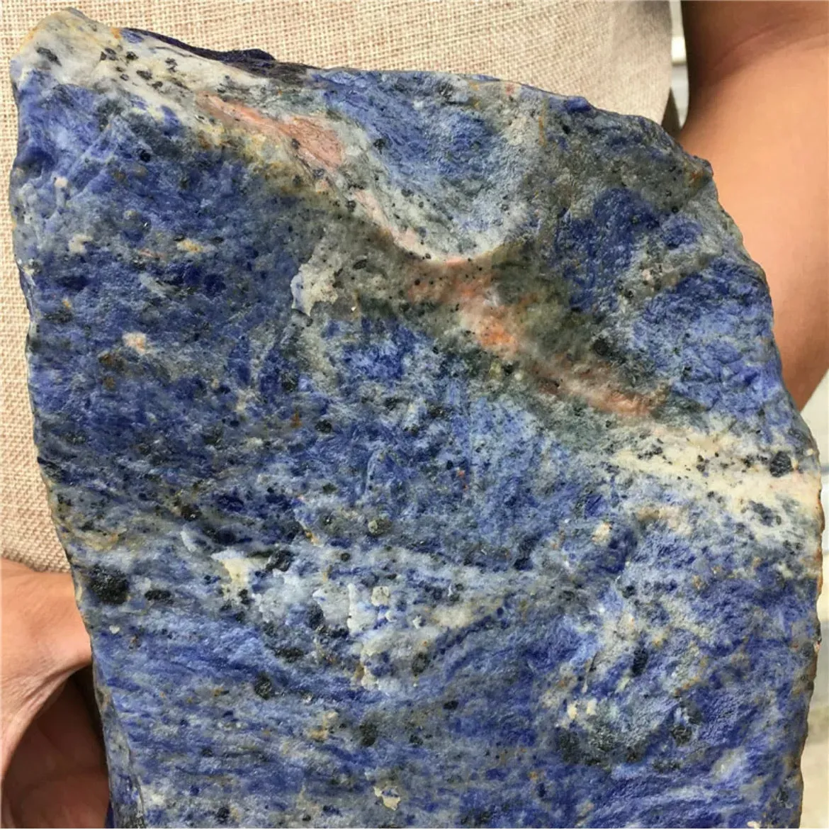 Natural sodalite gemstone rough rock with flat bottom for display